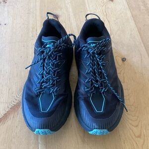 HokaOne One SpeedGoat 4 Black and Blue Womens Athletic Shoes with Rugged Design